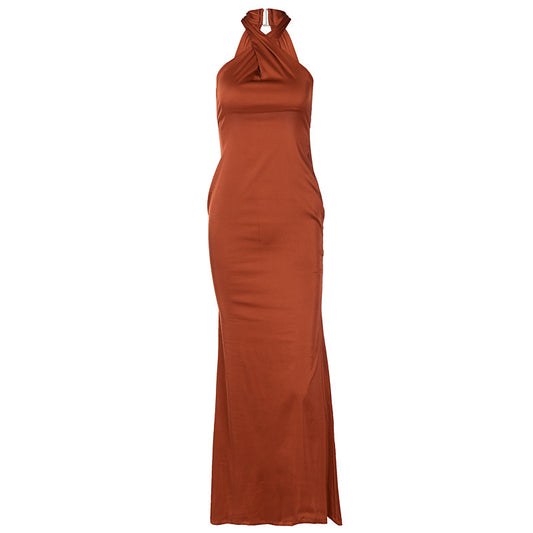 Long rust-colored dress with a halter neck on a white background